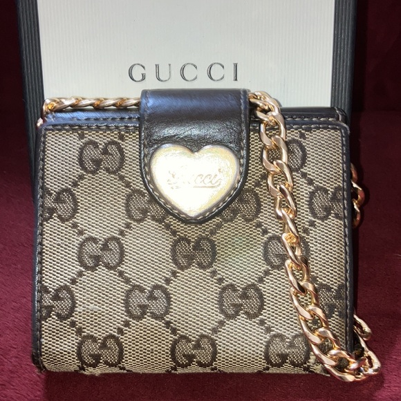 Gucci Handbags - GUCCI MONAGRAM WALLET with gold Gucci etched heart and gold unbranded chain